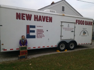 Lily donated 26 boxes of Girl Scout cookies to the New Haven Food Bank.